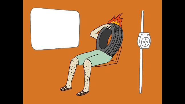 Eine Figur sitzt im Bus, hat einen Reifen als Oberkörper und Feuer als Haare
