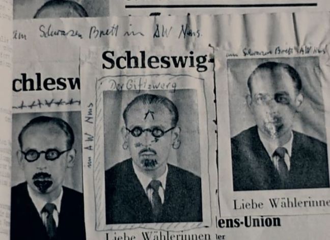 Der „rote“ Kurt in der Zeitung, mit Kugelschreiber ein Ulrich Bart und Brille gemalt