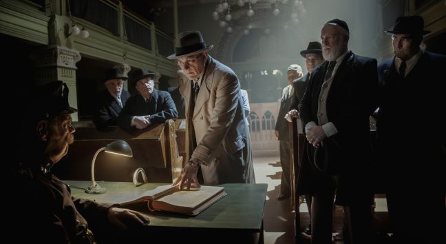 Abraham Stiller (Ville Virtanen) persuades Police Chief Ryynänen (Tomi Salmela) to allow the Jewish refugees to remain in Finland.