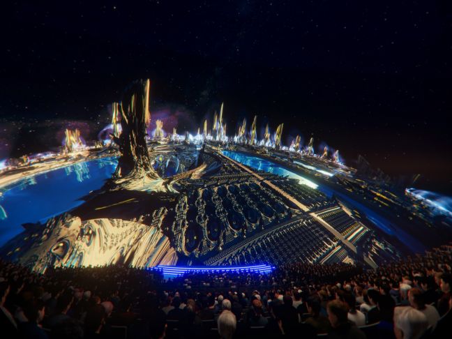 Vor Publikum sind Türme  und Infrastruktur in gold, blau und weiß zu sehen