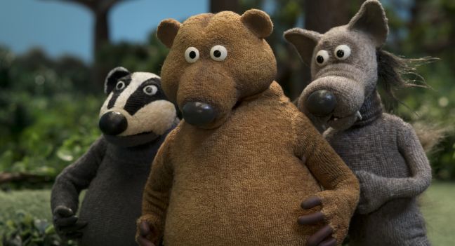 Bär, Wolf und Dachs schauen neugierig